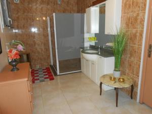 a bathroom with a shower and a sink and a table at Maison Monica Exeptionnel-Jardin paysage ZEN in Coursan +13 photos