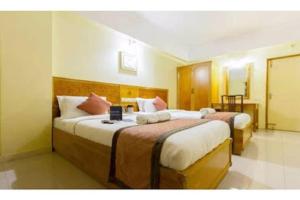 Cama o camas de una habitación en Hotel Metro Manor