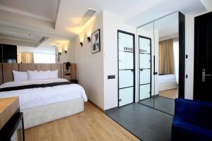 Katil atau katil-katil dalam bilik di Genesis Kosher Hotel Tbilisi