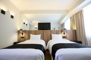 Katil atau katil-katil dalam bilik di Genesis Kosher Hotel Tbilisi