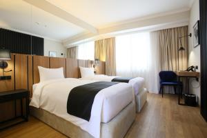 Katil atau katil-katil dalam bilik di Genesis Kosher Hotel Tbilisi