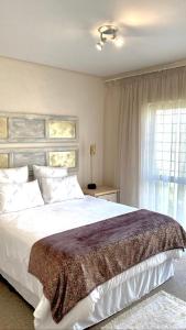 A bed or beds in a room at NNS Vaal River Luxury 3 Bedrooms Apartment