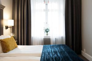 Letto o letti in una camera di Elite Stora Hotellet Linköping