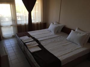 Ένα ή περισσότερα κρεβάτια σε δωμάτιο στο Guest House ,,Emotion''