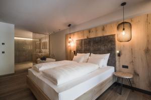 A bed or beds in a room at AhriaPura