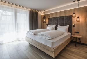 A bed or beds in a room at AhriaPura