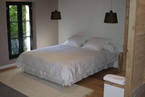 Malis Castera Le Petit Château客房内的一张或多张床位