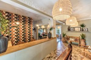 a lobby of a restaurant with a table and chairs at Creta Vitalis in Kalathas