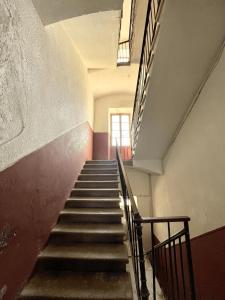 a row of stairs leading up to a staircase at L'Escale chambres privées chez l'habitant JFDL in Bonifacio