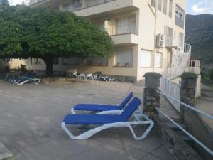 a pair of blue lounge chairs on a patio at Cal toà in Coll de Nargó