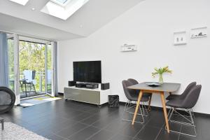 TV a/nebo společenská místnost v ubytování Ferienwohnung Kala