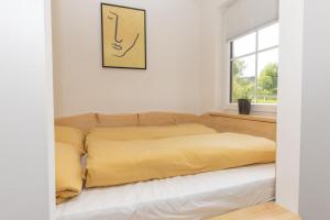 Postel nebo postele na pokoji v ubytování Tinyhouse am km8komma2