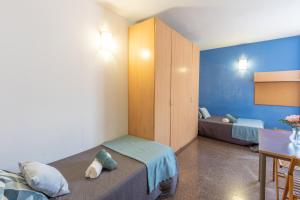 Postel nebo postele na pokoji v ubytování Residencia Universitaria La Ciutadella