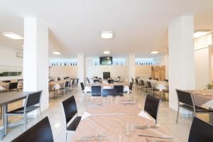 a dining room with tables and chairs and a cafeteria at Il Casale del Golfo in Vico Equense +19 photos