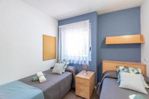 Posteľ alebo postele v izbe v ubytovaní Residencia Universitaria Resa La Ciutadella