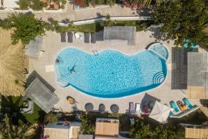 an overhead view of a swimming pool in a resort at Lakki Village in Aegiali