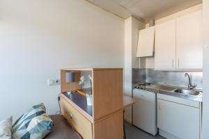 Kuchyň nebo kuchyňský kout v ubytování Residencia Universitaria Resa Lesseps + 35 fotografií