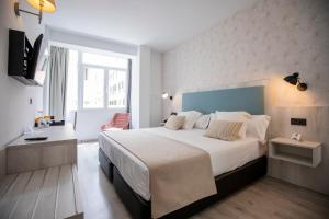 Posteľ alebo postele v izbe v ubytovaní Soho Boutique Bahía Málaga