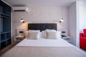 Posteľ alebo postele v izbe v ubytovaní Soho Boutique Bahía Málaga