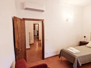 Posteľ alebo postele v izbe v ubytovaní Chianti Craft House Badia a Passignano