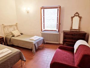 Posteľ alebo postele v izbe v ubytovaní Chianti Craft House Badia a Passignano