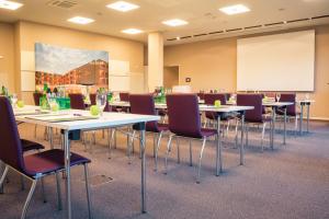 a conference room with tables and chairs at Hotel König Albert in Bad Elster