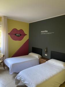 Postel nebo postele na pokoji v ubytování Hotel Bayona