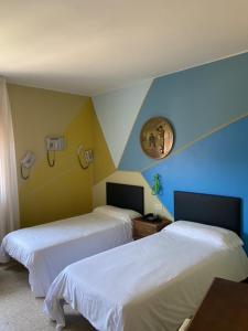 Postel nebo postele na pokoji v ubytování Hotel Bayona