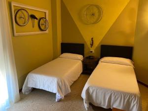 Postel nebo postele na pokoji v ubytování Hotel Bayona