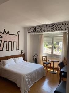 Postel nebo postele na pokoji v ubytování Hotel Bayona