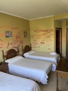 Postel nebo postele na pokoji v ubytování Hotel Bayona