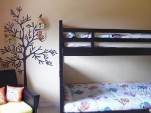 Postel nebo postele na pokoji v ubytování Gîte Les Framboisiers
