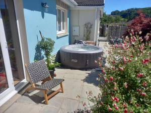 a hot tub on the patio of a house at No 9 Manor Way in Carmarthen