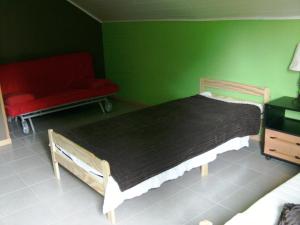 Postel nebo postele na pokoji v ubytování Gîte Les Framboisiers