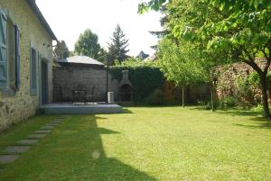 Vonkajšia záhrada v ubytovaní La Ferme aux Fleurs