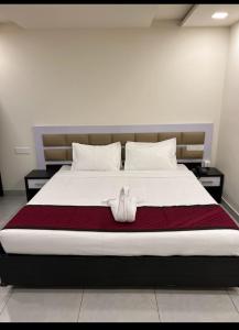 Postel nebo postele na pokoji v ubytování Clarks Inn Express ,Sirkazhi