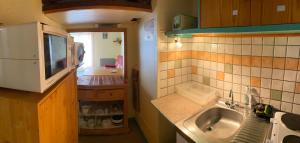 Kuchyňa alebo kuchynka v ubytovaní Appartement Barèges centre du village