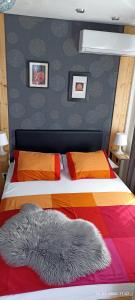 a bedroom with a bed with a colorful comforter at Apartment Travel hub *** in Varaždin