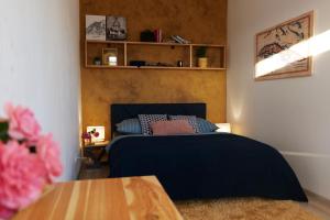 A bed or beds in a room at Apartmán - modern home