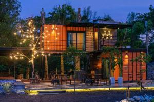 a house with a patio in front of it at night at TTS Lake Villa Broga Semenyih in Semenyih