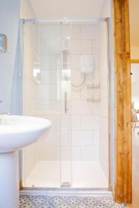 a bathroom with a shower and a sink at Muntjac View, Beechcroft Barns, Cawston, Norfolk in Norwich