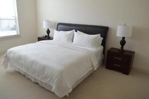 מיטה או מיטות בחדר ב-Domain at CityCentre
