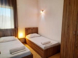Ένα ή περισσότερα κρεβάτια σε δωμάτιο στο Apartments Alavana
