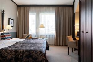 Postel nebo postele na pokoji v ubytování Elite Palace Hotel & Spa