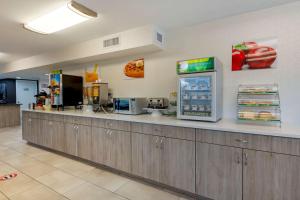 a fast food restaurant with a counter with a machine at Quality Inn St Augustine Outlet Mall in Saint Augustine