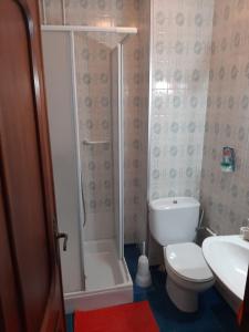 a bathroom with a shower and a toilet and a sink at Las Palmeras 1 in Águilas +6 photos