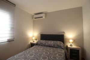 Postel nebo postele na pokoji v ubytování Adosado La Fresca by Rental Olé + 30 fotografií