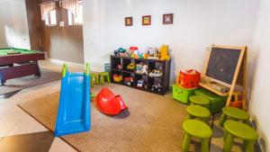 a room with a classroom with a chalkboard and chairs at Chata u Bronka in Białka Tatrzanska