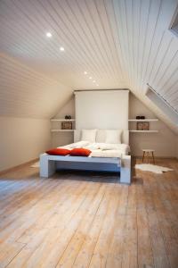 a bedroom with a bed in a attic at B&B Maison Blanche in Ghent