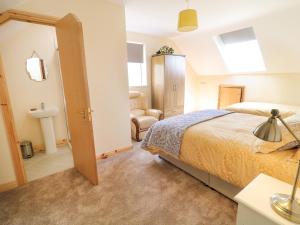 a bedroom with a large bed and a bathroom at Sleibhte Sliabh Liag in Meananeary +18 photos